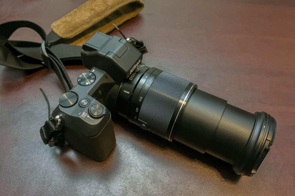 The 1 Nikon 10-100mm f/4-5.6 expands to over 5-inches (~13cm) in length when fully extended.